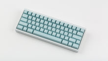Load image into Gallery viewer, Key kobo Glacier on a white keyboard angled