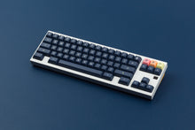 Load image into Gallery viewer, KAT Dark Milkshake on a white and yellow keyboard angled