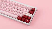 Load image into Gallery viewer, Key Kobo Darling on a white keyboard zoomed in right