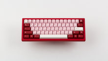 Load image into Gallery viewer, Key Kobo Darling on a red keyboard centered