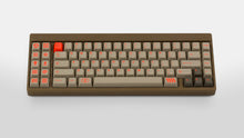 Load image into Gallery viewer, Key Kobo Signet on a brown keyboard