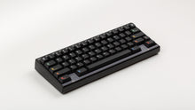Load image into Gallery viewer, Keycapsule Prism dark on a black Keycult Zero with PC WKL accent bar angled