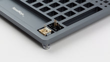 Load image into Gallery viewer, Lubrication Station with some switch bottom housings and springs in the switch opener slots
