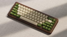 Load image into Gallery viewer, Render of DCS Cream Cheese R3 keycaps on dark gray keyboard, side profile view