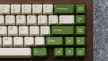 Load image into Gallery viewer, Render of DCS Cream Cheese R3 keycaps on red keyboard, dramatic lighting close-up