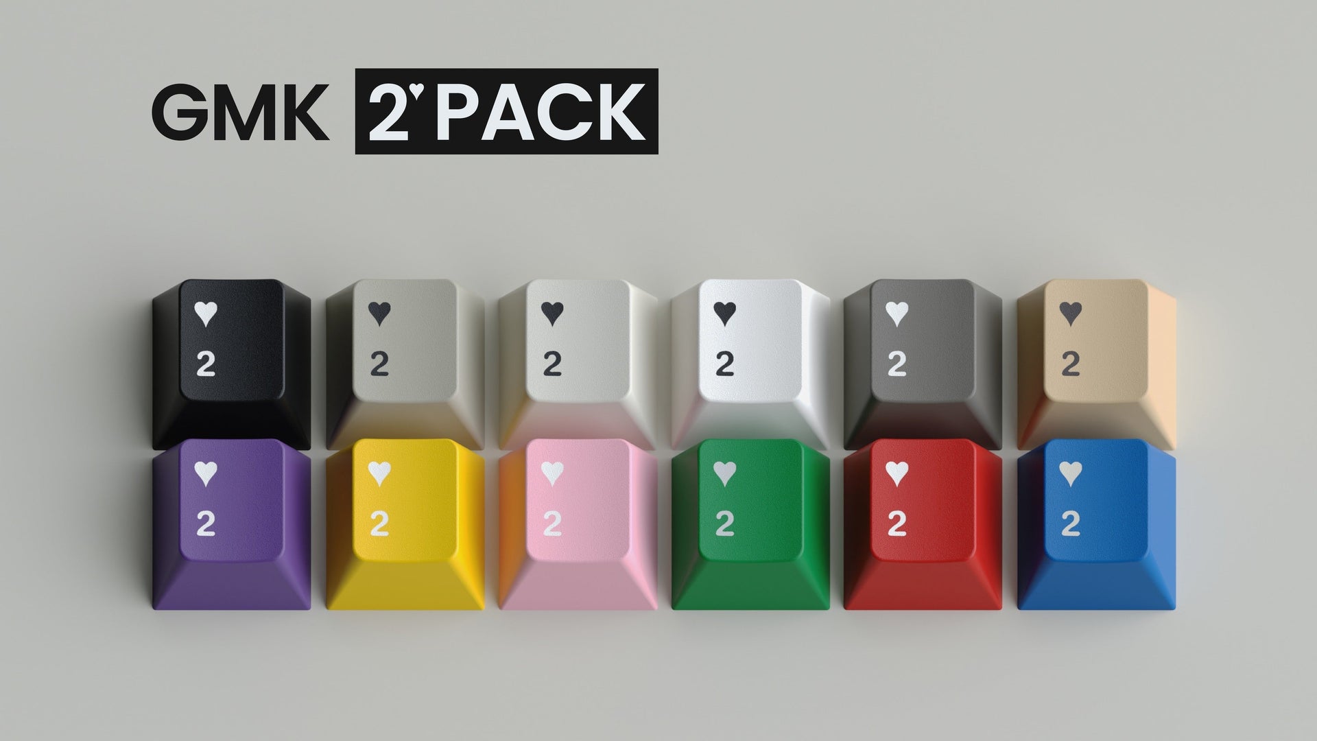 Render of the GMK 2Pack keycap set - twelve heart-2 keycaps in twelve colors with the GMK 2Pack logo