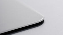 Load image into Gallery viewer, Close-up of the Matrix MP-01 mouse pad rounded, chamfered tempered-glass edge