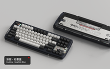 Load image into Gallery viewer, Render of Matrix Carnival keyboard in Coated Graphite Blue, showing front with keycaps and back with decorative weight