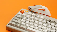 Load image into Gallery viewer, NK-M1 beige mouse and beige Classic TKL keyboard on an orange background, close-up