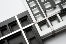 Load image into Gallery viewer, render of two box 75s side by side. One black stainless steel and the other white pvd