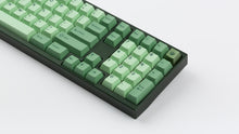 Load image into Gallery viewer, GMK CYL Zooted on a green keyboard zoomed in on right