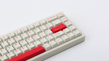 Load image into Gallery viewer, Cherry Ember on a beige keyboard zoomed in right