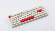 Load image into Gallery viewer, Cherry Ember on a beige keyboard angled