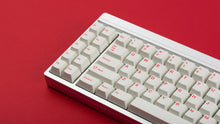 Load image into Gallery viewer, Cherry Ember on a silver keyboard zoomed in left