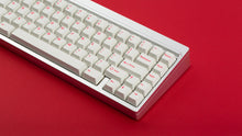 Load image into Gallery viewer, Cherry Ember on a silver keyboard zoomed in right