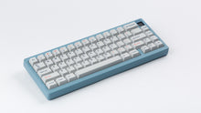 Load image into Gallery viewer, Cherry Industrial Keys on a blue Corsa angled