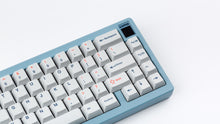 Load image into Gallery viewer, Cherry Industrial Keys on a blue Corsa zoomed in on right