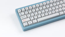 Load image into Gallery viewer, Cherry Industrial Keys on a blue Corsa zoomed in on left