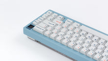 Load image into Gallery viewer, Cherry Industrial Keys on a blue Corsa back view right side