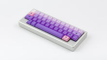 Load image into Gallery viewer, Kam Li'l Dragon on a silver keyboard angled