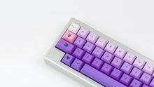 Load image into Gallery viewer, Kam Li'l Dragon on a silver keyboard zoomed in on left