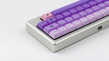 Load image into Gallery viewer, Kam Li'l Dragon on a silver keyboard zoomed in on right back