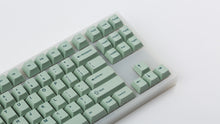 Load image into Gallery viewer, Cherry Sage on a translucent NK87 zoomed in on the right