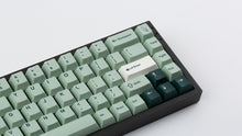 Load image into Gallery viewer, Cherry Sage on a black NK65 zoomed in on the right