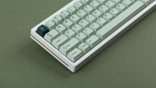 Load image into Gallery viewer, Cherry Sage on a white keyboard zoomed in on left
