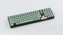 Load image into Gallery viewer, Cherry Sage on a dark green keyboard