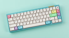 Load image into Gallery viewer, Cherry Milkshake on a blue keyboard angled