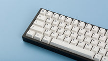 Load image into Gallery viewer, Cherry Milkshake on a black keyboard zoomed in left