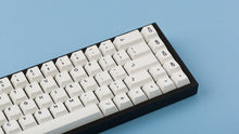 Load image into Gallery viewer, Cherry Milkshake on a black keyboard zoomed in right