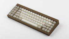 Load image into Gallery viewer, Cherry Spellbook on a brownish gold keyboard angled