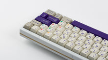 Load image into Gallery viewer, Cherry Spellbook on a white keyboard zoomed in on right back