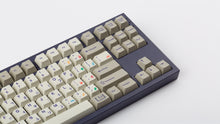 Load image into Gallery viewer, Cherry Spellbook on a purple NK87 keyboard zoomed in on right