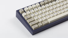 Load image into Gallery viewer, Cherry Spellbook on a purple NK87 keyboard zoomed in on left