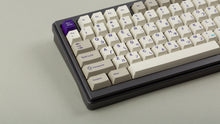 Load image into Gallery viewer, Cherry Spellbook on a gray keyboard zoomed in on left