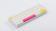 Load image into Gallery viewer, TFUE Keycaps on a translucent NK65 Keyboard angled
