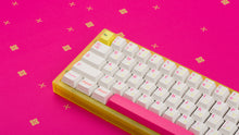 Load image into Gallery viewer, yellow tfue edition case with keycaps on tfue deskpad left side