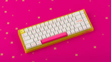 Load image into Gallery viewer, yellow tfue edition case with keycaps on tfue deskpad wide angle
