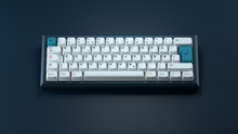 Load image into Gallery viewer, GMK CYL Colorchrome on blue keyboard centered