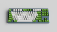 Load image into Gallery viewer, JTK Royal Alpha on a gray keyboard centered